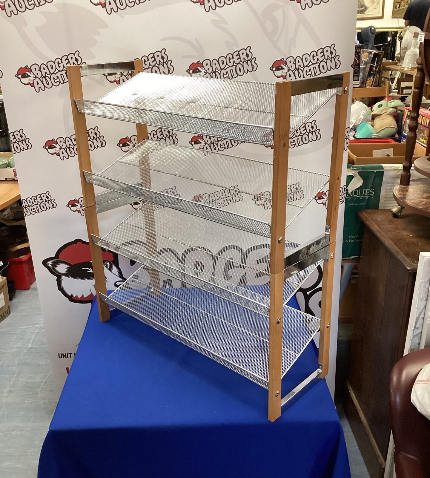 Two wooden & mesh shoe racks