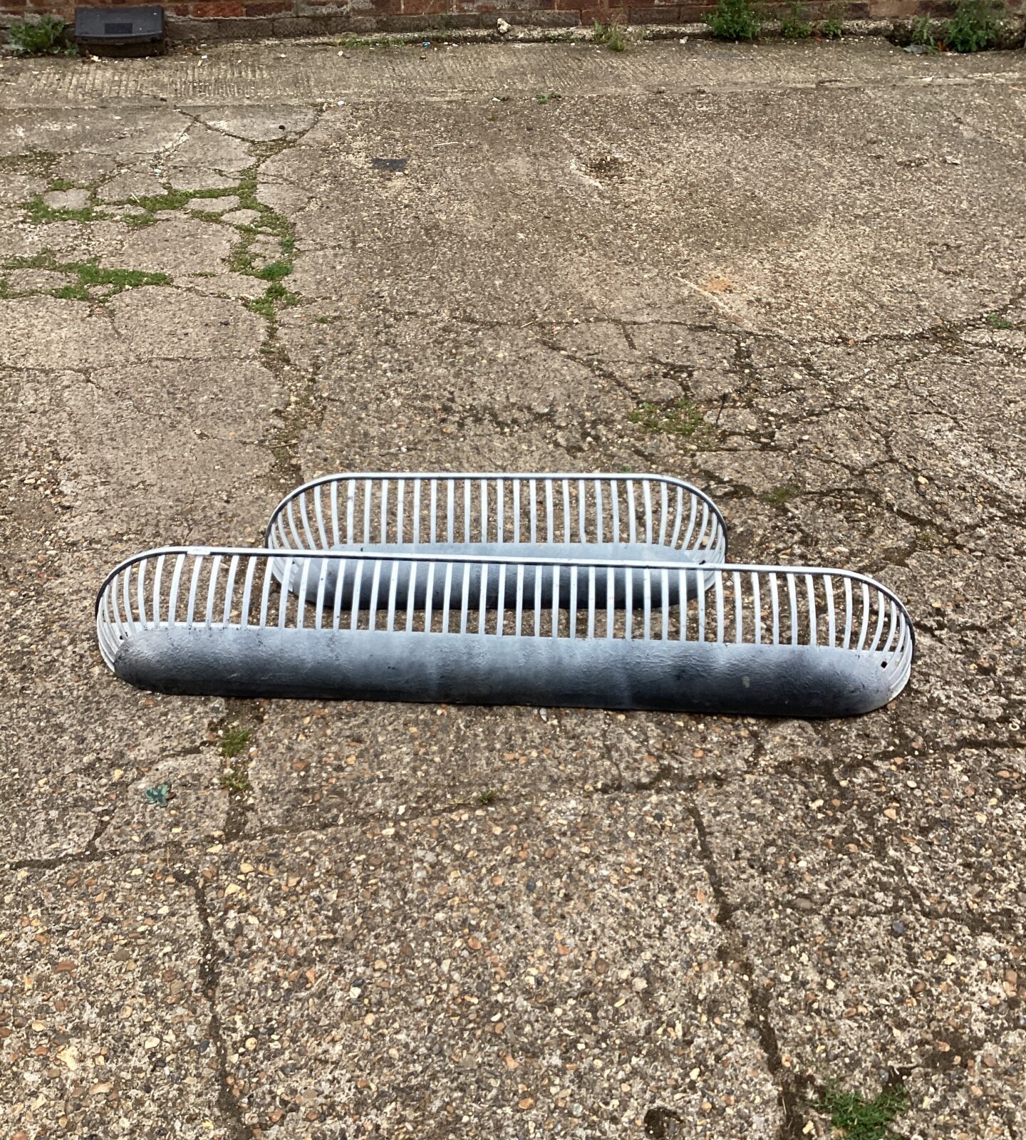Two metal wall mounted Flower troughs
