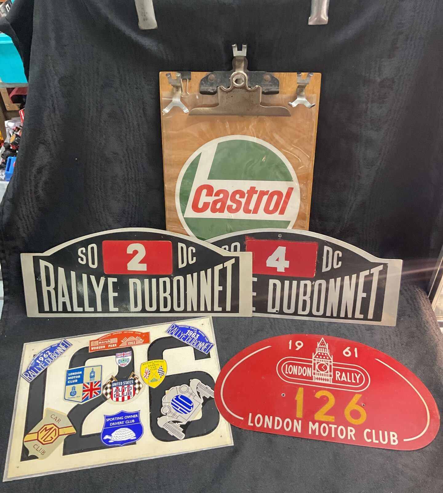 Motor racing time keepers board and four car rally plates