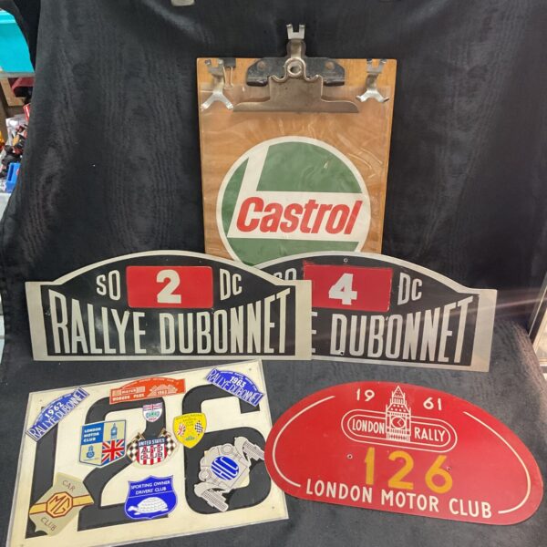 Motor racing time keepers board and four car rally plates