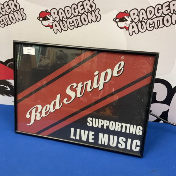 Illuminated Red Stripe pub sign for bar decor.