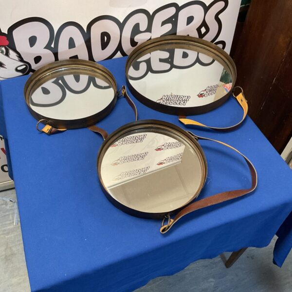 Three metal framed leather strapped mirrors