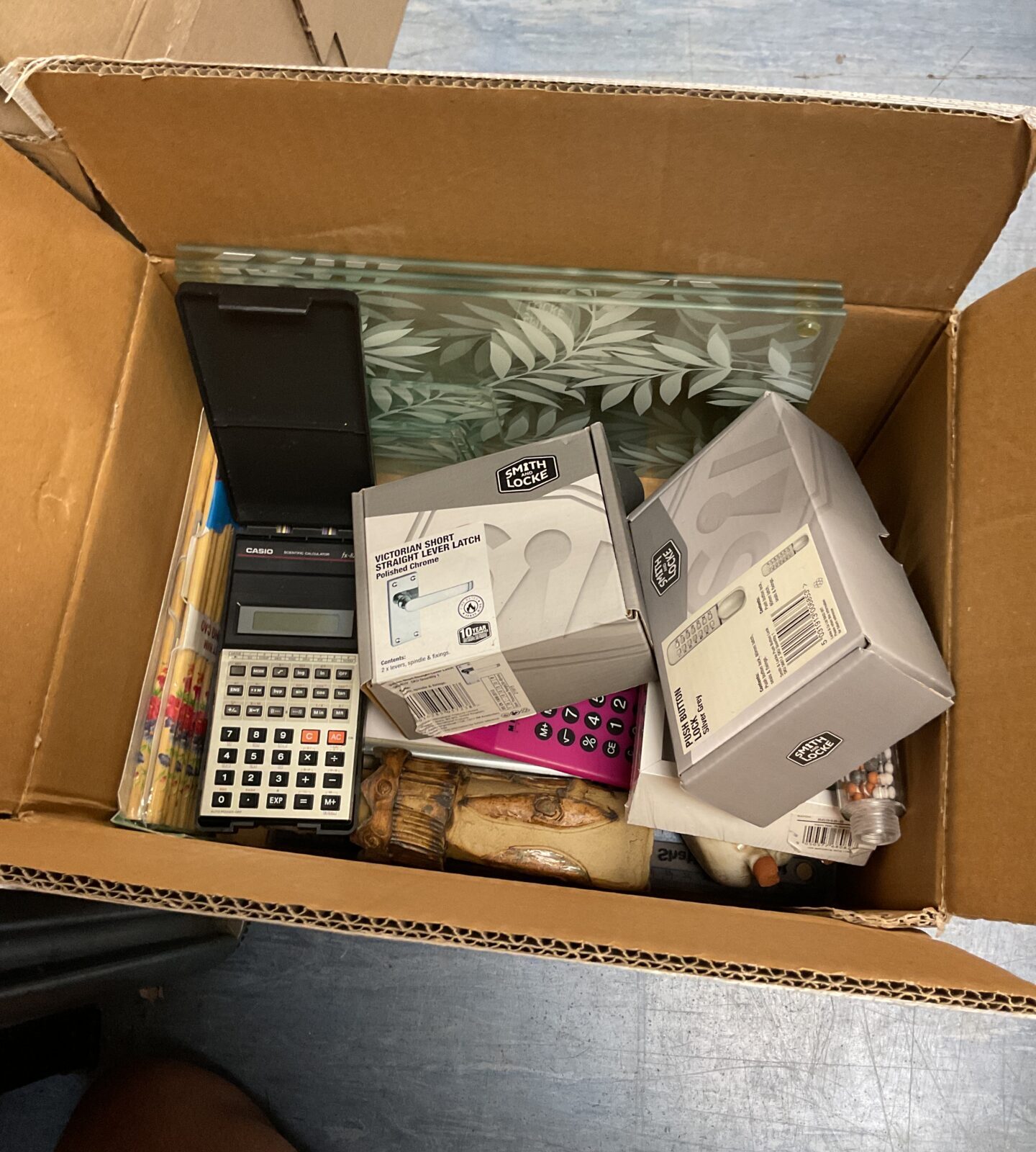 Box of mixed inc casio calculator and smith and lock new door locks