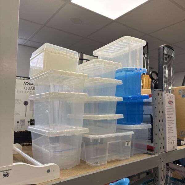 Lot of clear plastic storage tubs for home organisation.