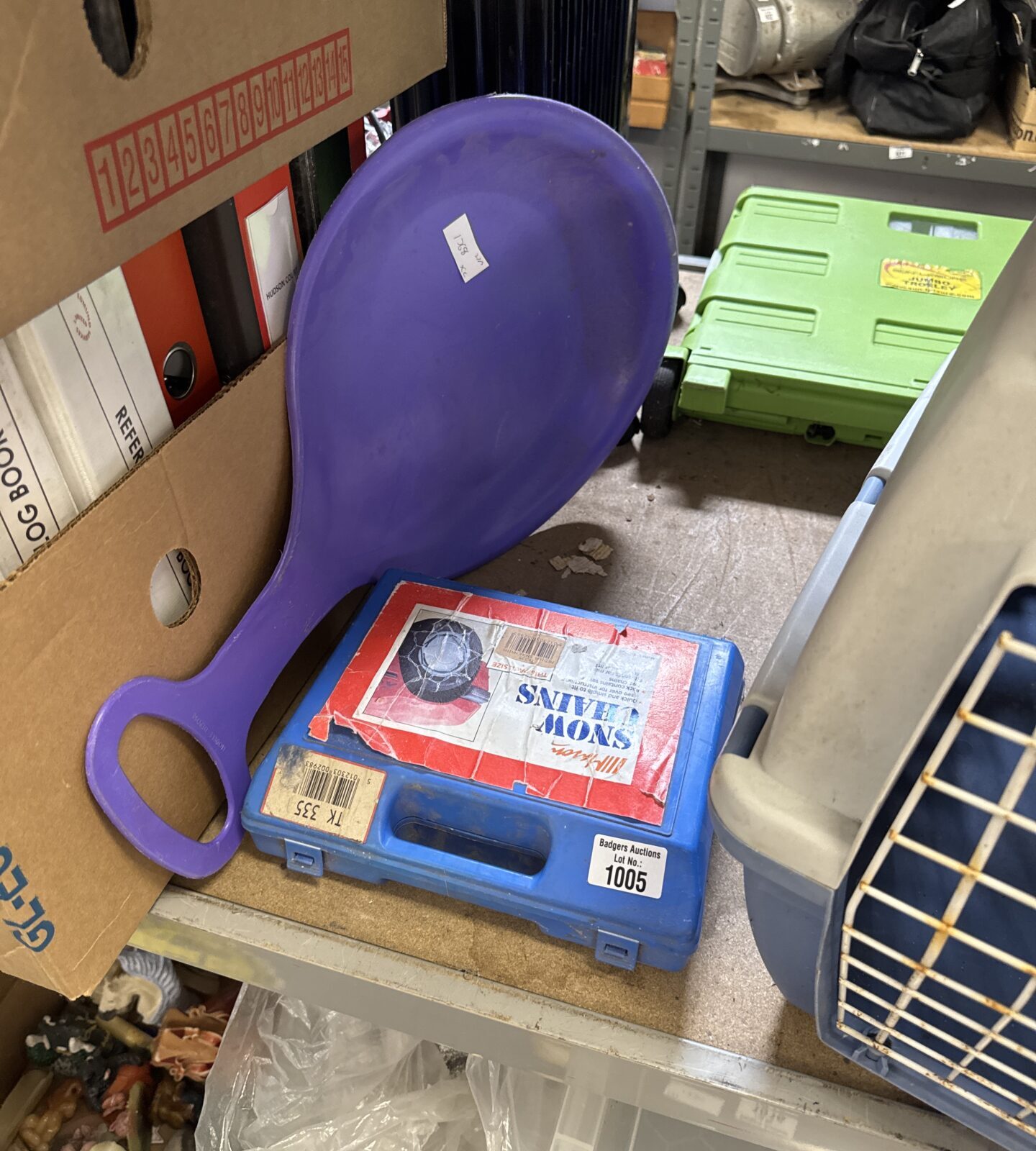 Set of snow chains with a snow shovel