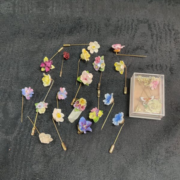 Twenty Floral stick pins and two earrings