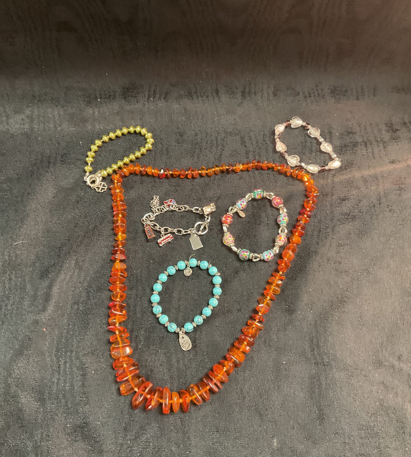 Four bracelets and a anger necklace