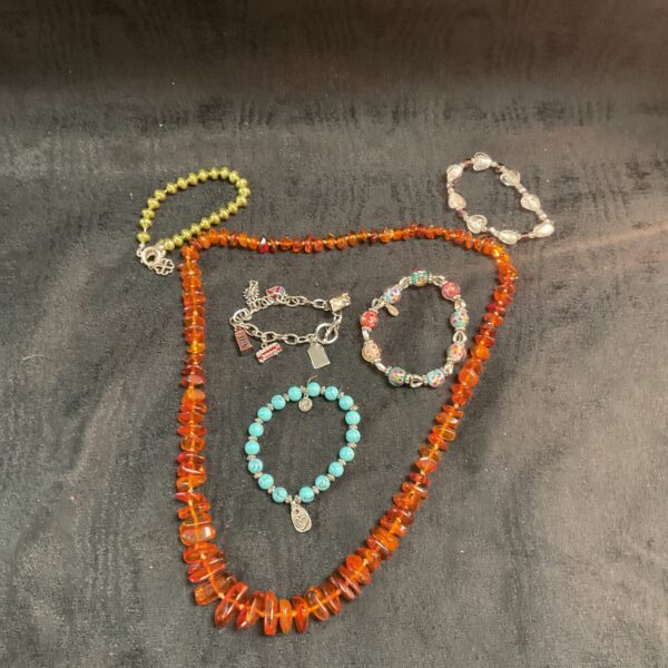 Four bracelets and a anger necklace