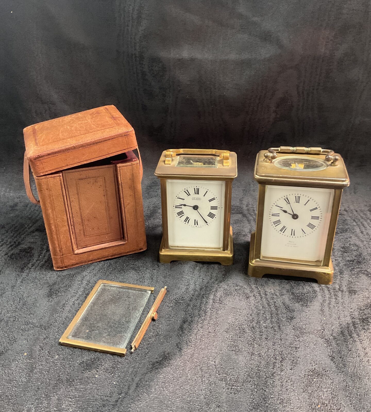 Two vintage carriage clocks one with travel case