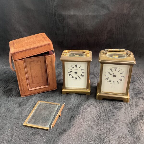 Two vintage carriage clocks one with travel case