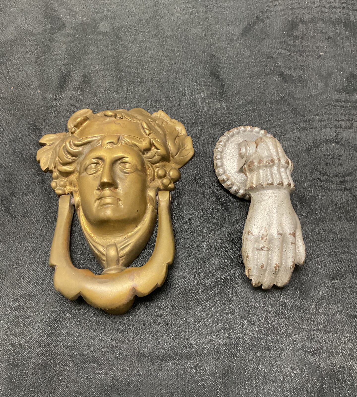 Two vintage door knockers brass Greek goddess and Hand with ball cast iron door knockers