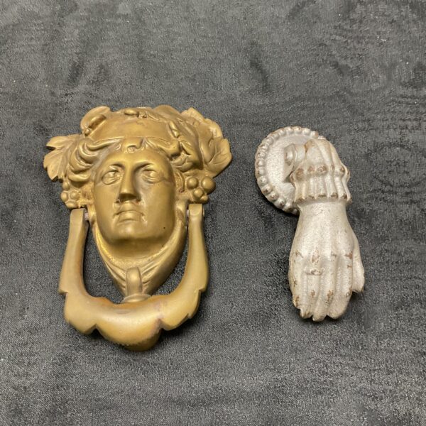 Two vintage door knockers brass Greek goddess and Hand with ball cast iron door knockers