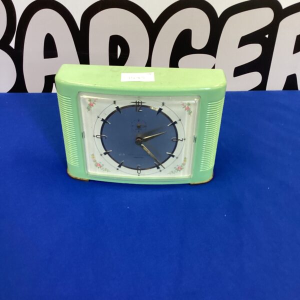 Vintage green bakelite Wehrle alarm clock, mid-century modern style.