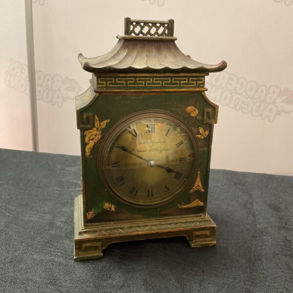 Antique Callow mantle clock with pagoda design, green case, and floral details.