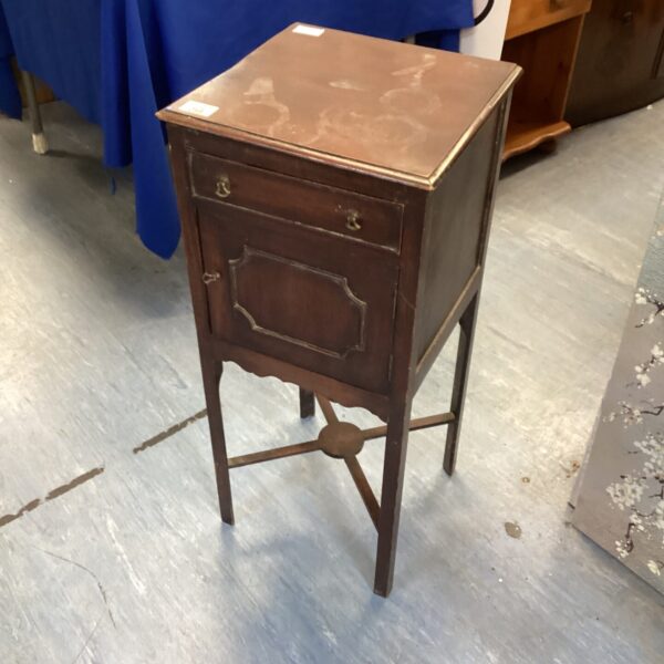 Antique Victorian vanity cabinet with single drawer and curved legs.