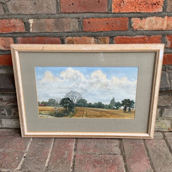 Artist signed watercolour landscape of farmland with buildings