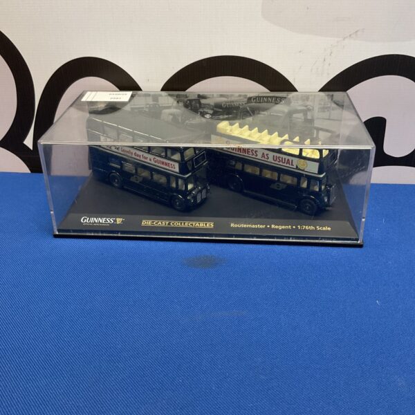 Two oxford diecast guinness collectable busses in display case
