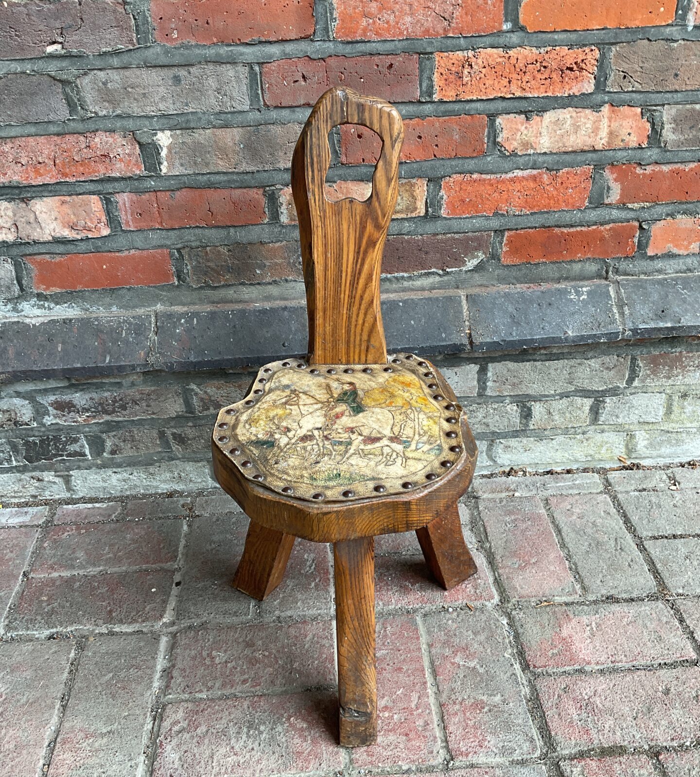 Vintage oak milk maids stool with leather hunt scene seat