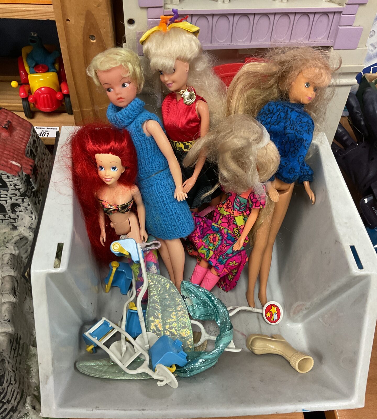Box of dolls and accessories