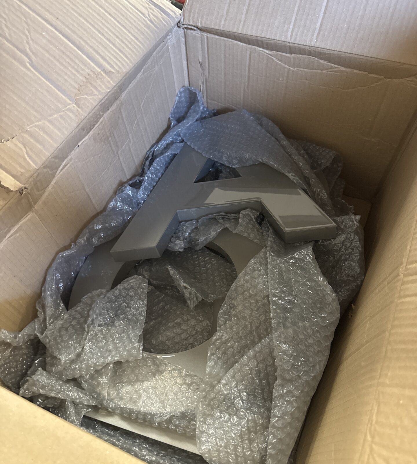 Box of large metal lettering to spell Clarkson (surplus from Clarkson’s farm production)