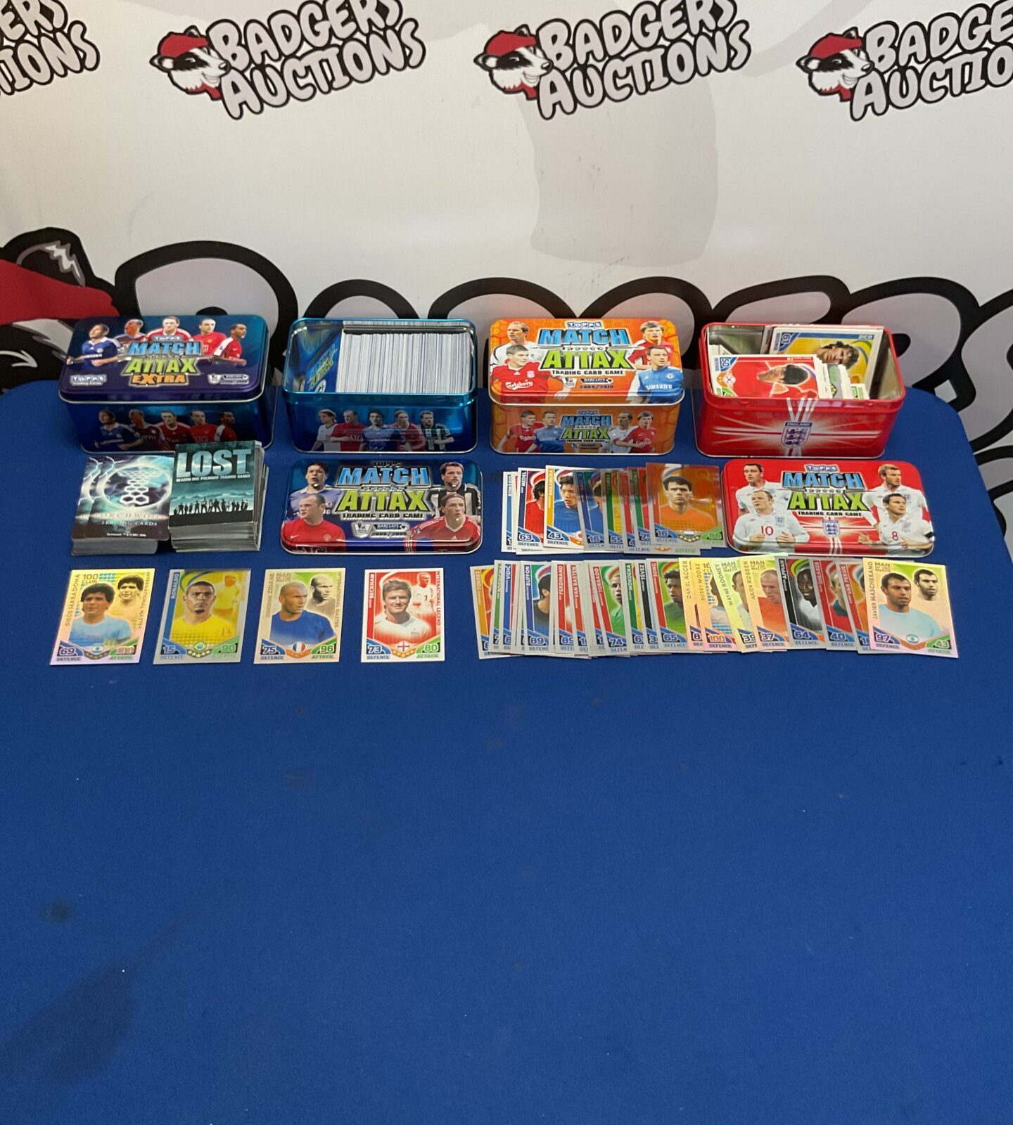 Collection of match attax cards in tins with other cards