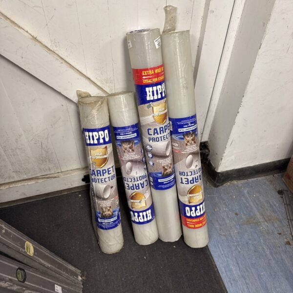 Four rolls of hippo carpet protector