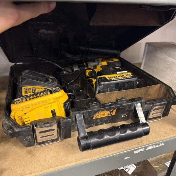 Dewalt DCD985M2 cordless drill with batteries and charger.