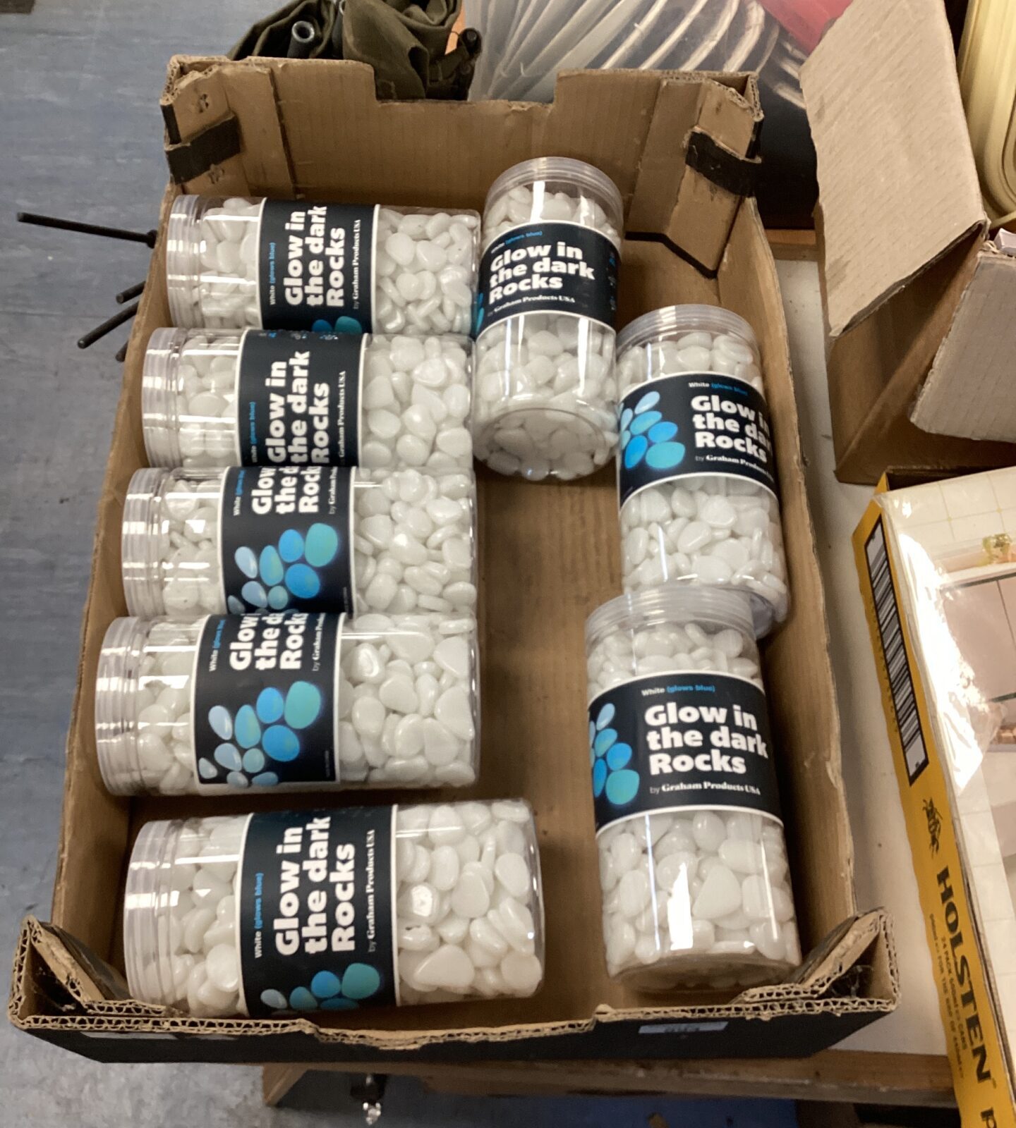 Eight tubs of glow in the dark rocks