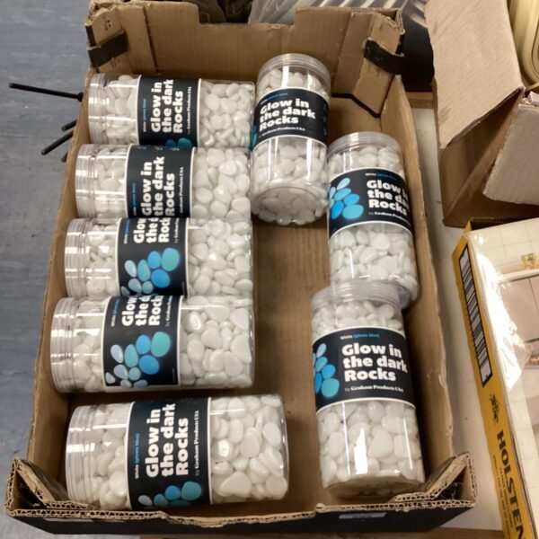Eight tubs of glow in the dark rocks