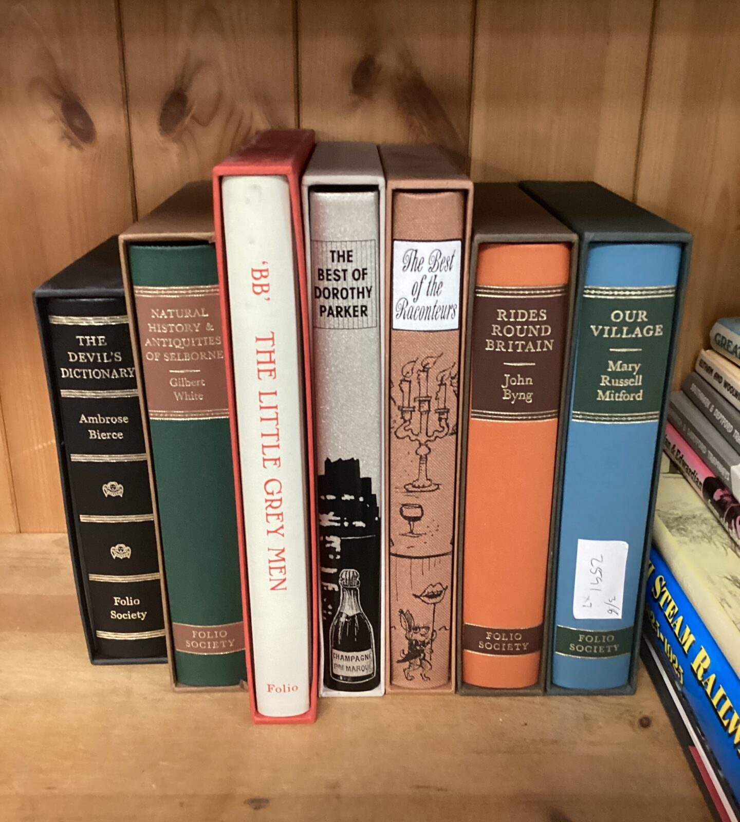 Seven folio society books incthe little grey men, rides round britain, our village, the devil’s dictionary & the best of the raconteurs
