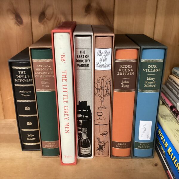 Seven folio society books incthe little grey men, rides round britain, our village, the devil’s dictionary & the best of the raconteurs