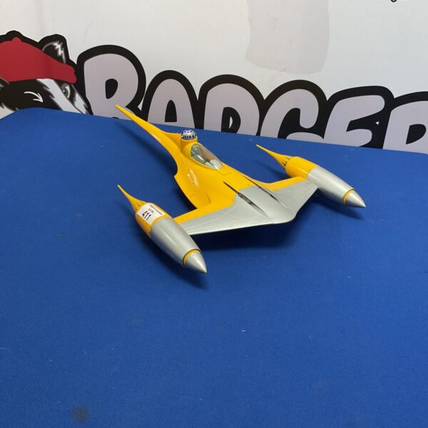 Vintage Hasbro Naboo Starfighter toy from Star Wars, a collectible spaceship.