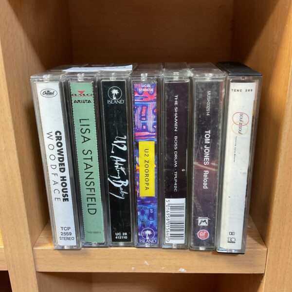Selection of retro music cassettes including tom jones & u2