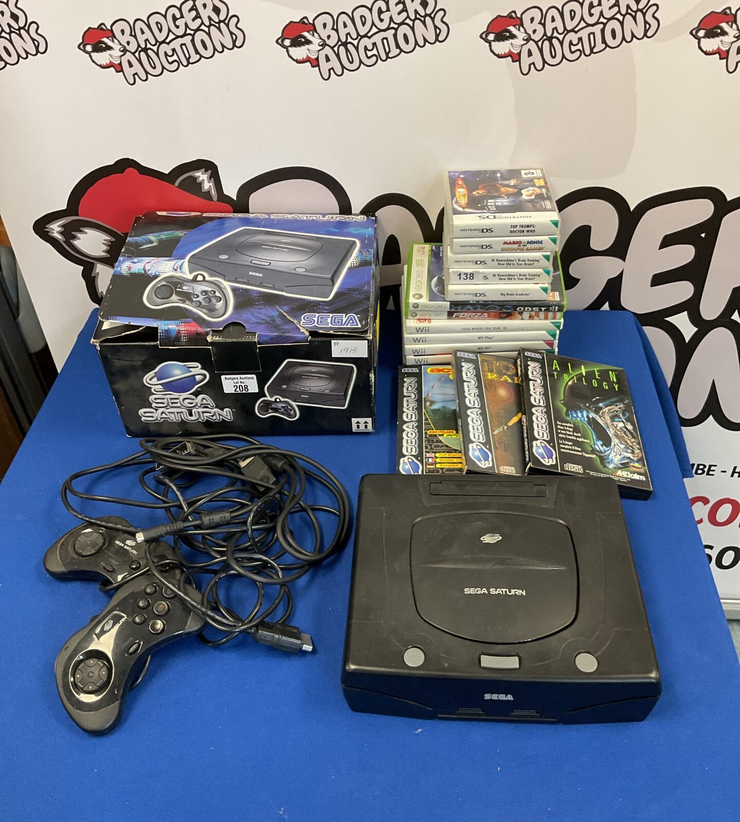 Sega Saturn console boxed with controllers & games