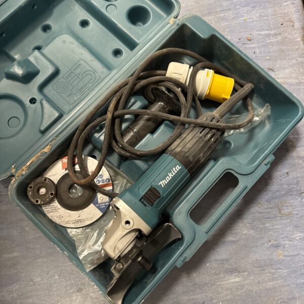 Makita GA4530R angle grinder in its original carry case, showing wear.