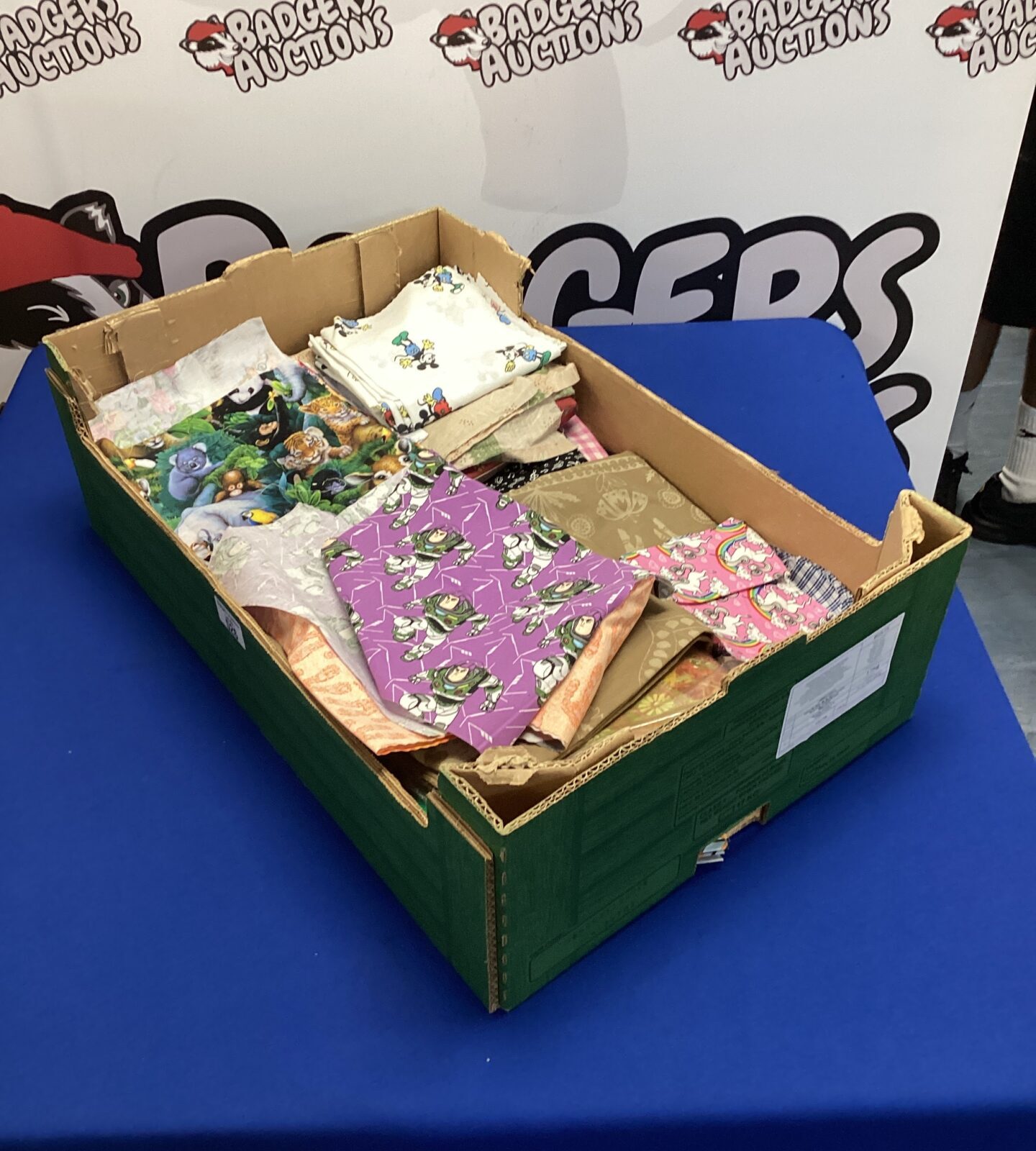 Box of upholsters off cuts of mixed fabrics