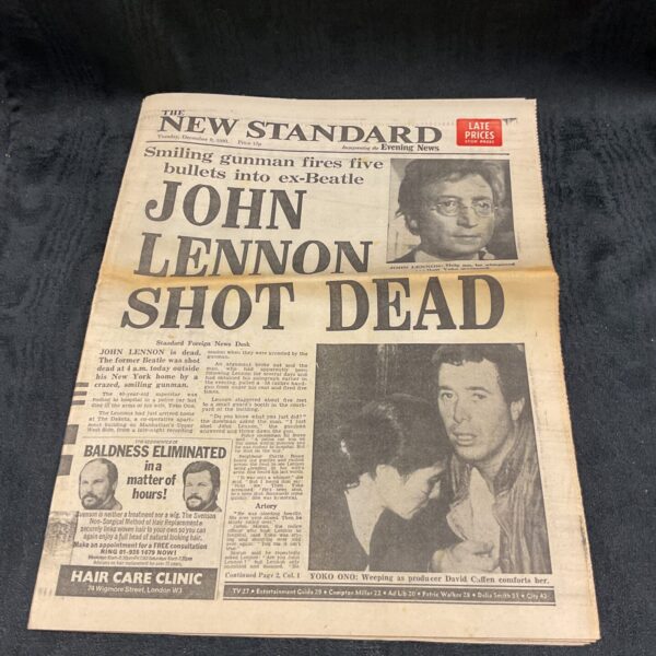 Vintage newspaper front page reporting John Lennon's assassination.