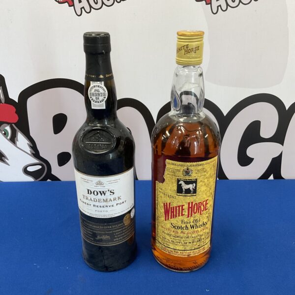 Sealed bottles of Dows trademark finest reserve port & white horse whisky