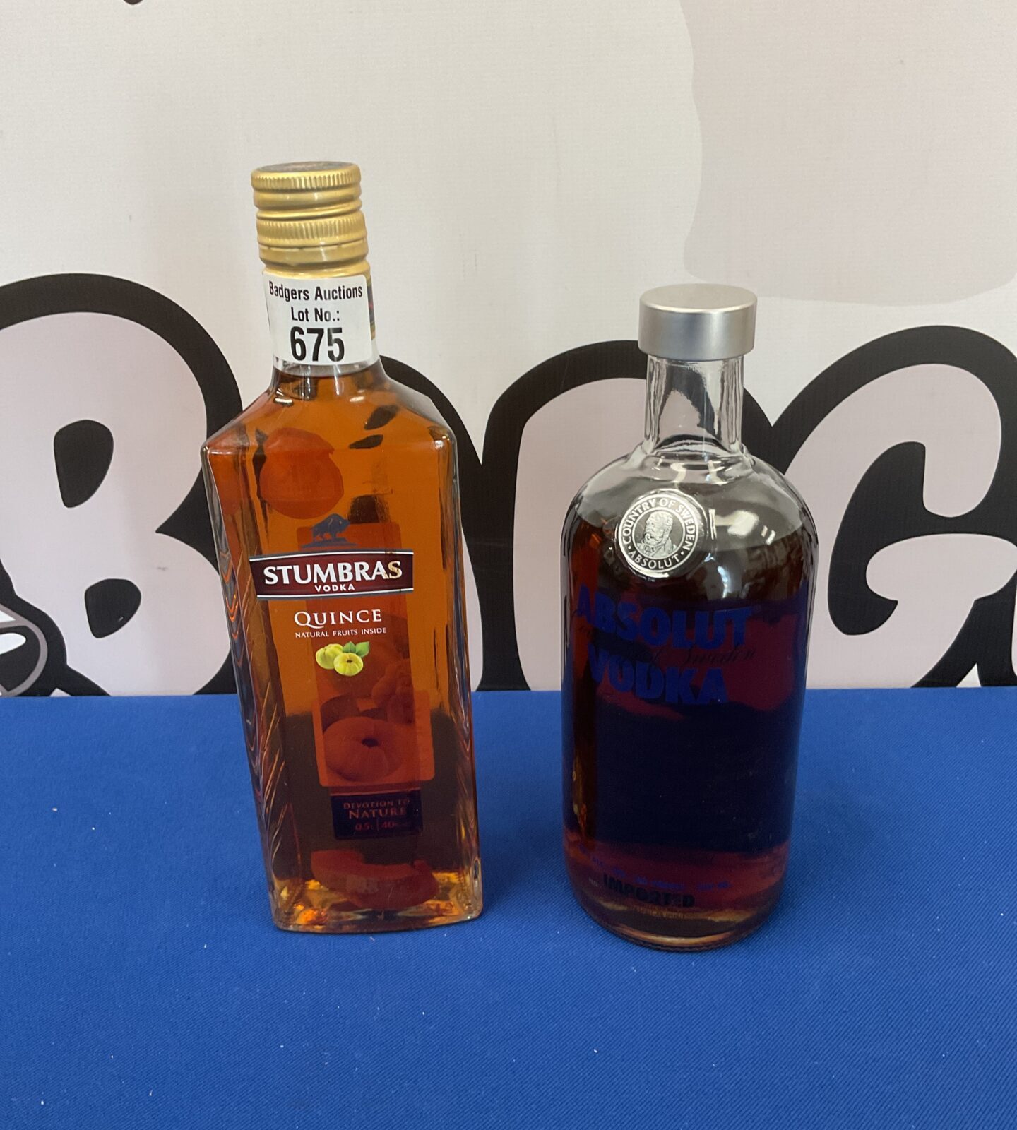 Sealed bottles of stumbras quince & absolute vodka