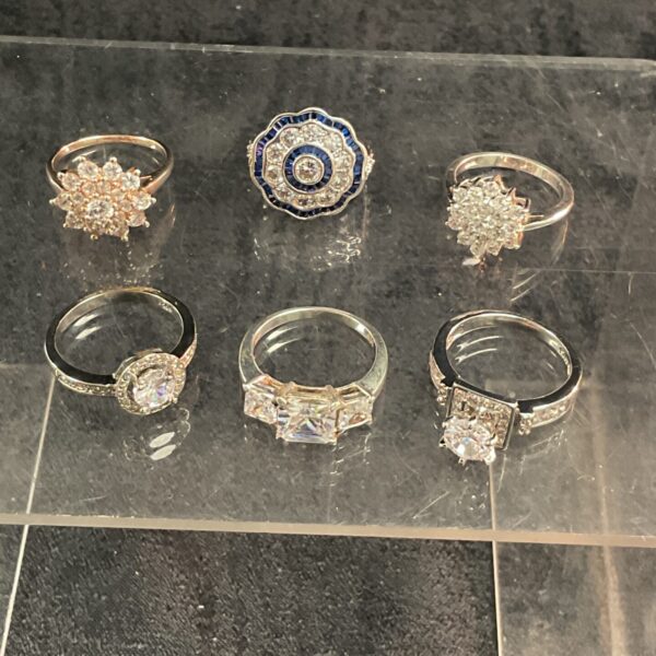 Lot of six silver rings with white stones.