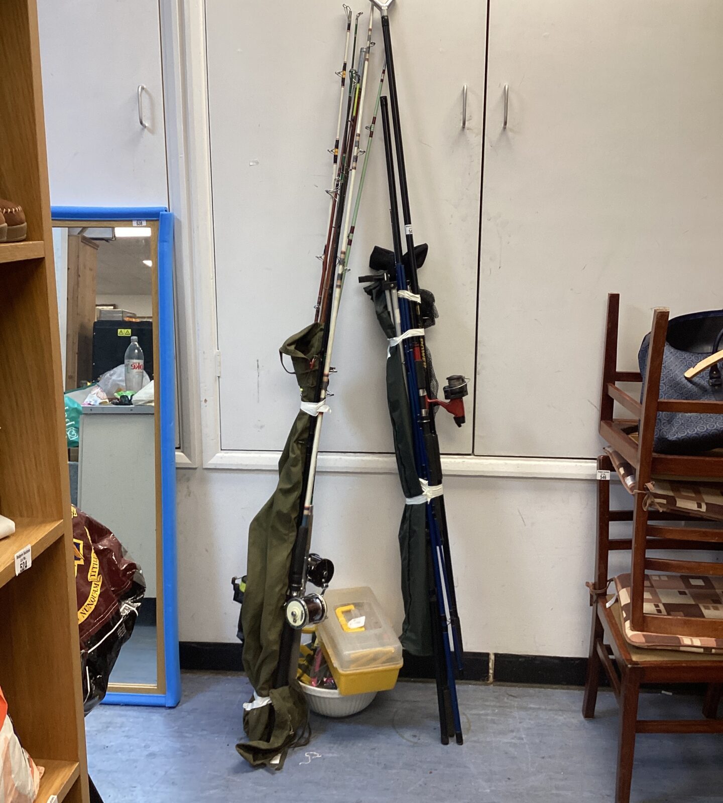 Bundle of fishing & sea boat fishing rods with tackle box & bowl of floats & other contents
