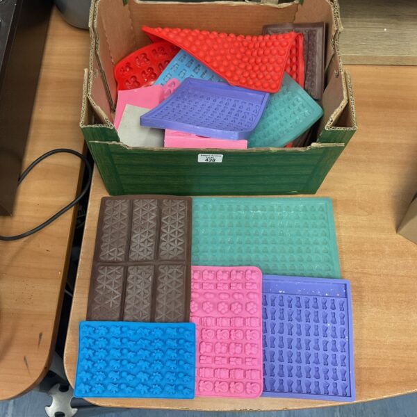 Box full of chocolate/ other moulds