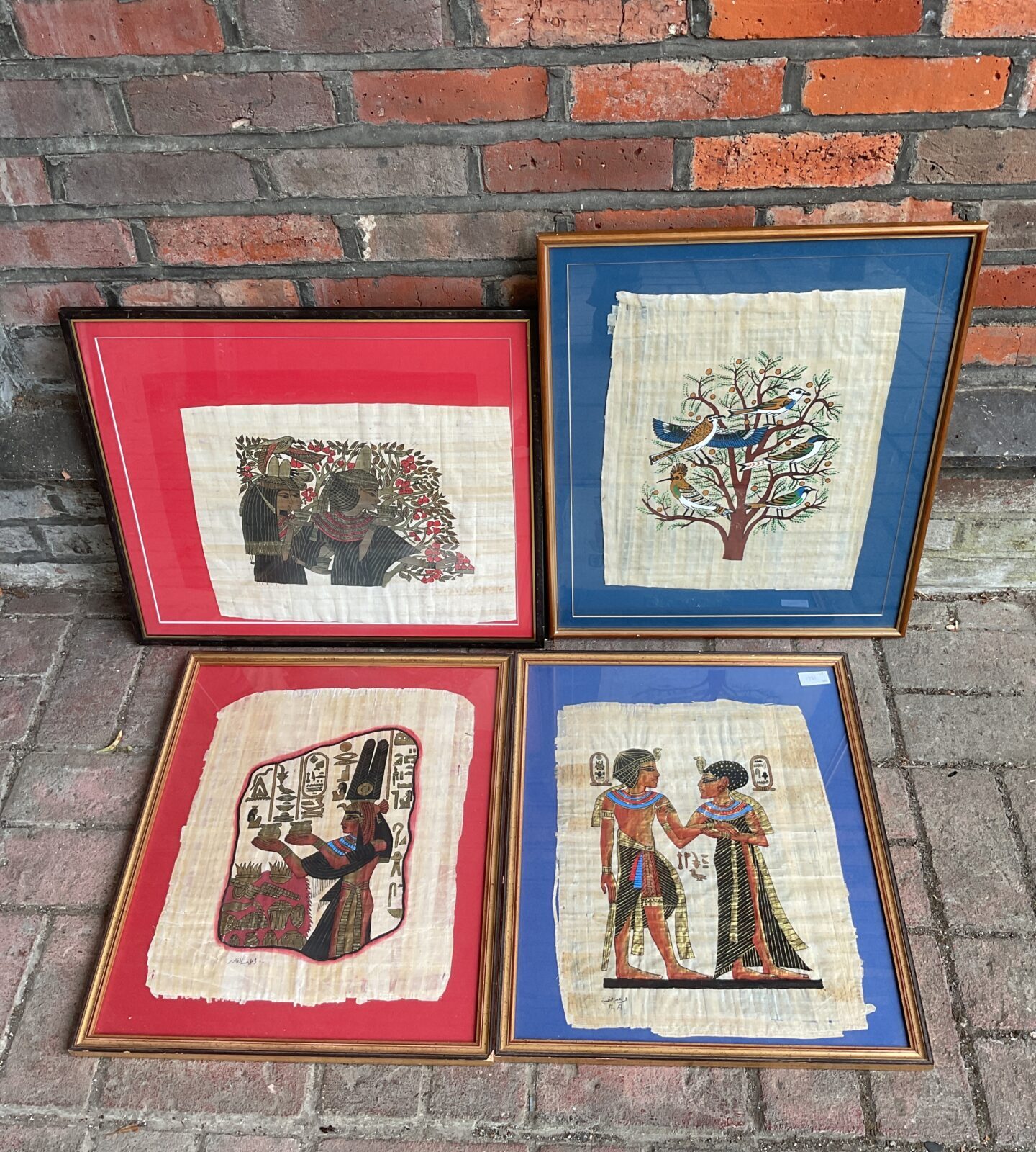 Four framed Egyptian artworks on papyrus