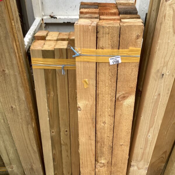 Three bundles of timber ready for construction or garden projects.