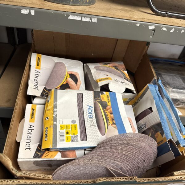 Tray of Mirka Abranet sanding pads for woodworking and automotive use.