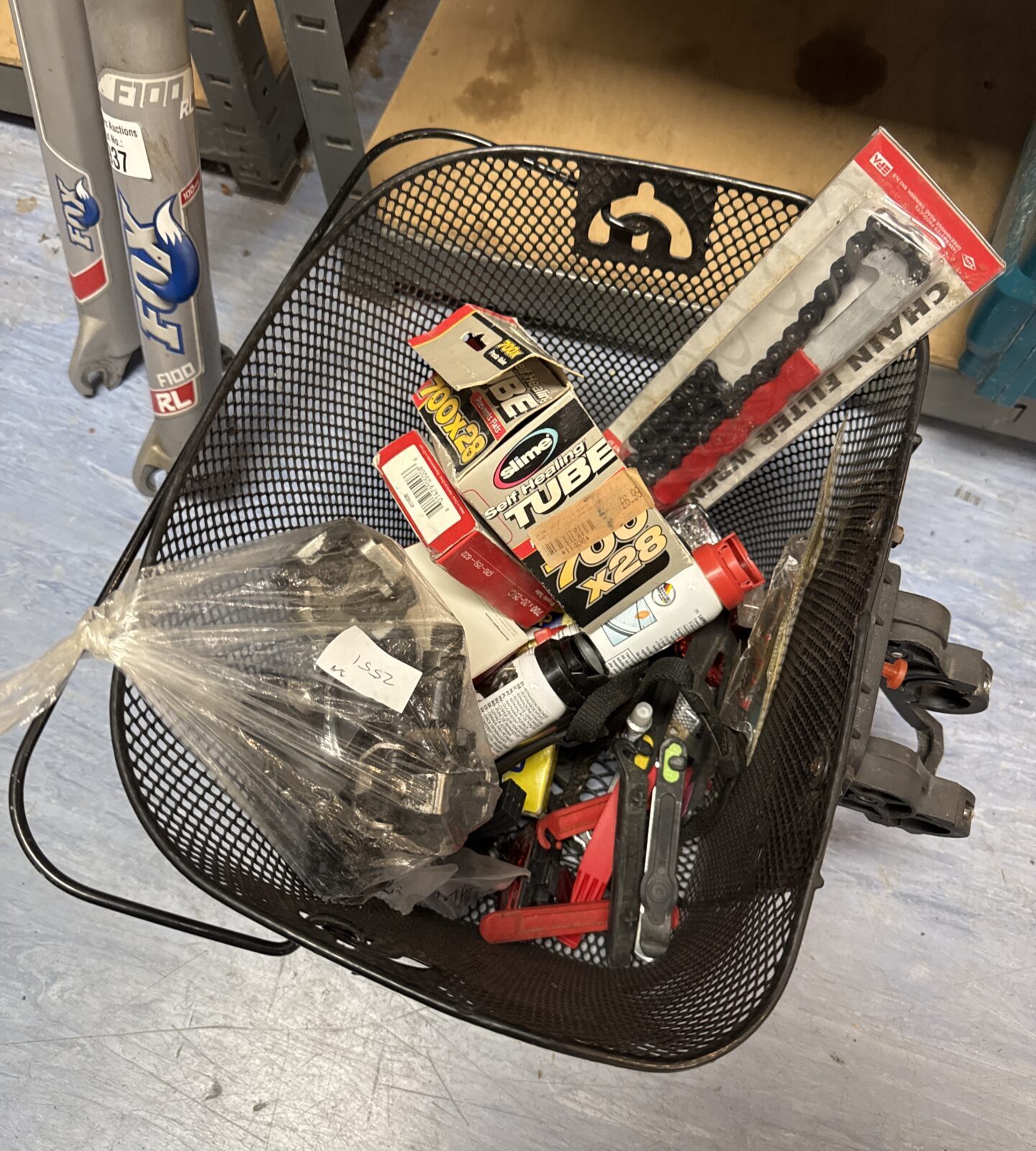 Basket of assorted bicycle parts