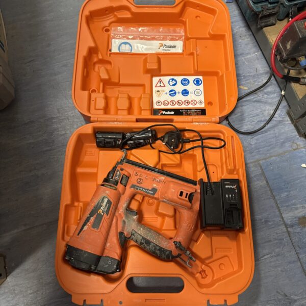 Orange Paslode Impulse cordless staple gun in carrying case.