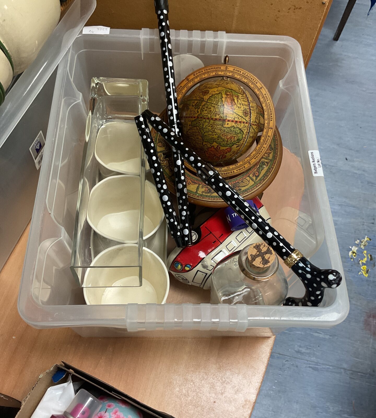 Box of mixed inc empty bumbu rum bottle and tabletop globe