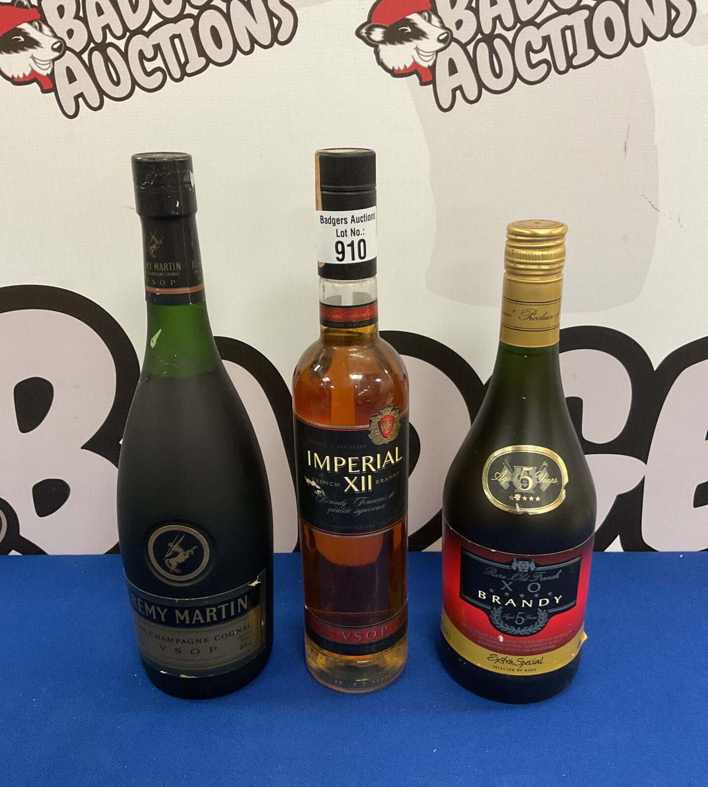 Three sealed bottles of alcohol including remy martin champagne cognac, imperial xii brandy & rare old french xo brandy
