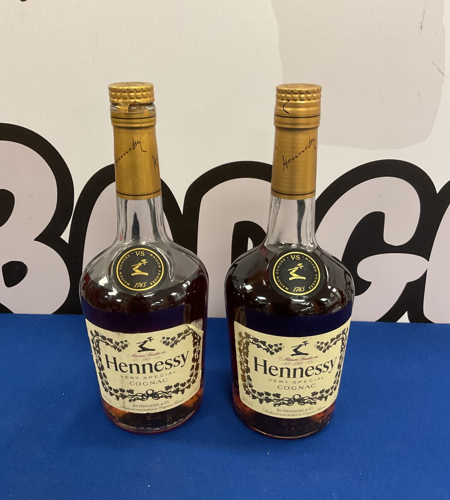 Sealed bottle of Hennessy cognac & part drunk bottle